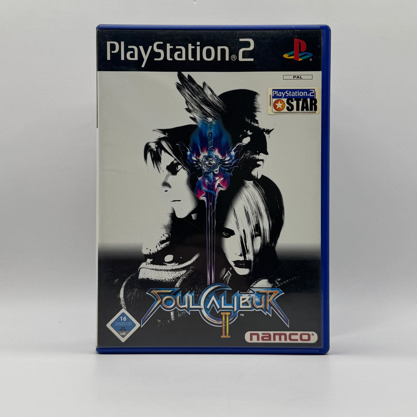 Verpackung des PS2-Spiels Soul Calibur II, ein 3D-Kampfspiel mit Waffen, vielfältigen Charakteren und schnellen, taktischen Duellen in unterschiedlichen Arenen.