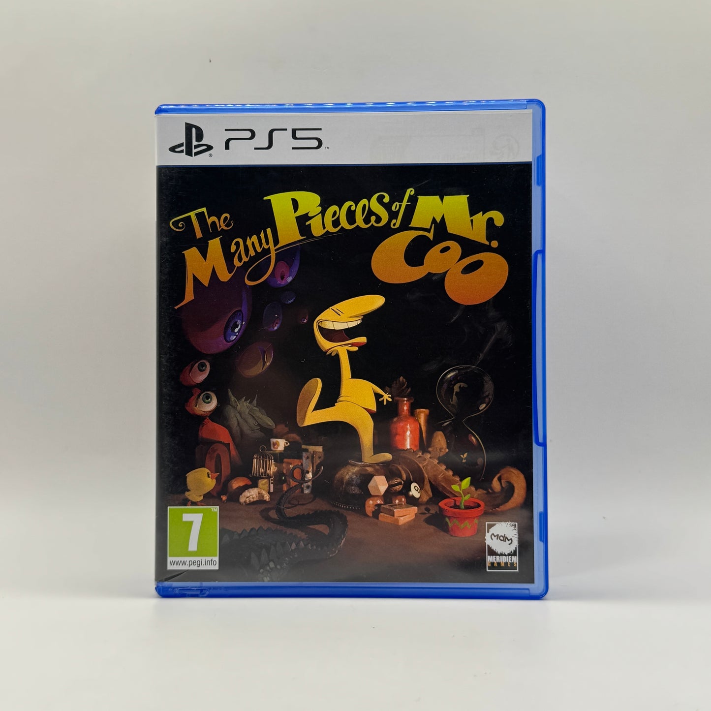 Verpackung des PS5-Spiels The Many Pieces of Mr. Coo, ein Adventure-Puzzle-Spiel, in dem Spieler den originellen Charakter Mr. Coo durch verschiedene Level steuern, Rätsel lösen und Geheimnisse entdecken.