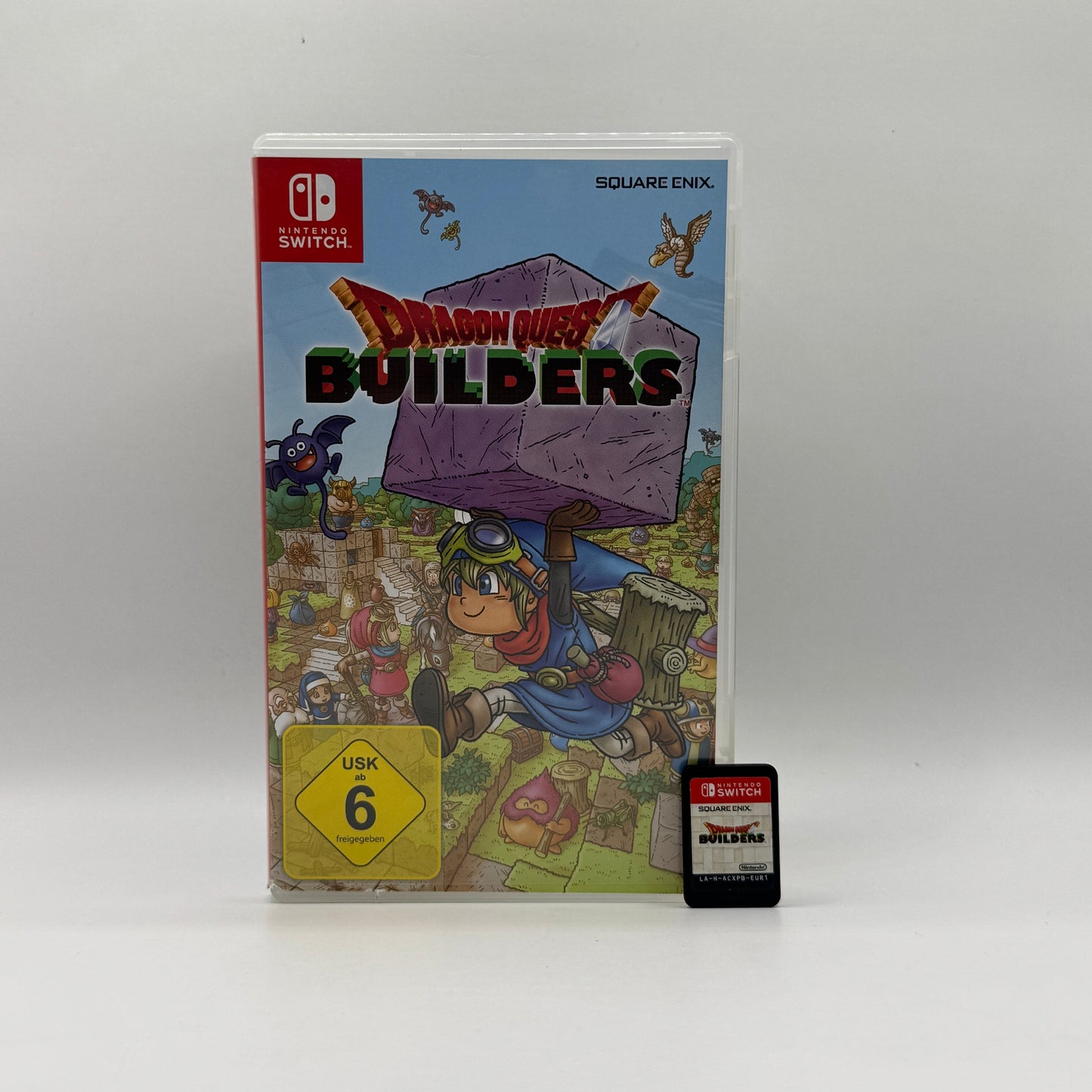 Verpackung des Nintendo Switch-Spiels Dragon Quest Builders, ein Rollenspiel mit Baumodus, in dem Spieler Materialien sammeln, Gebäude errichten und Monster in der Welt von Alefgard bekämpfen.