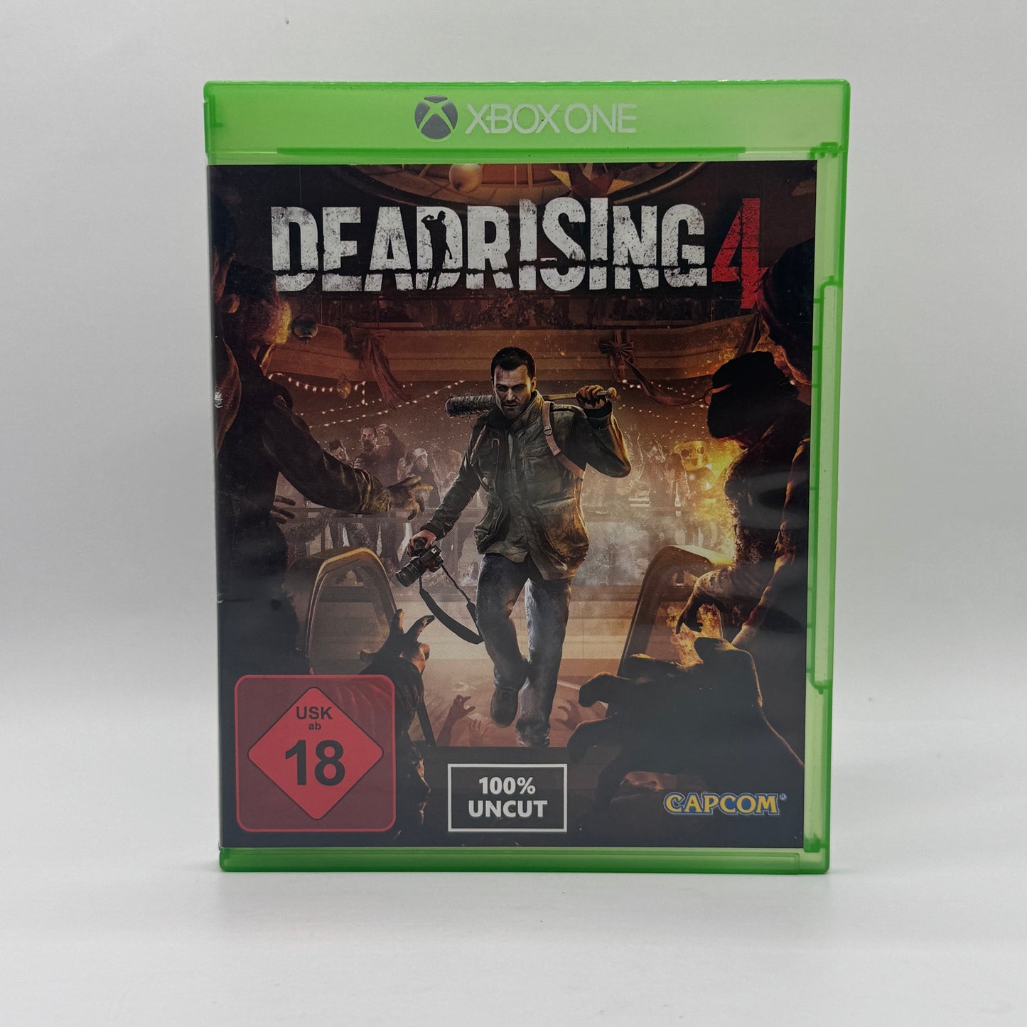 Verpackung des Xbox-One-Spiels Dead Rising 4, ein Actionspiel, in dem Spieler als Frank West Horden von Zombies mit improvisierten Waffen bekämpfen und eine offene Spielwelt erkunden.
