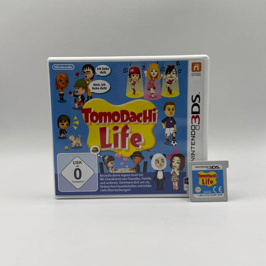 Verpackung des Nintendo 3DS-Spiels Tomodachi Life, eine Lebenssimulation, in der Spieler Mii-Charaktere erstellen, auf einer Insel leben lassen und deren Beziehungen, Alltagsleben und verrückte Ereignisse beobachten.