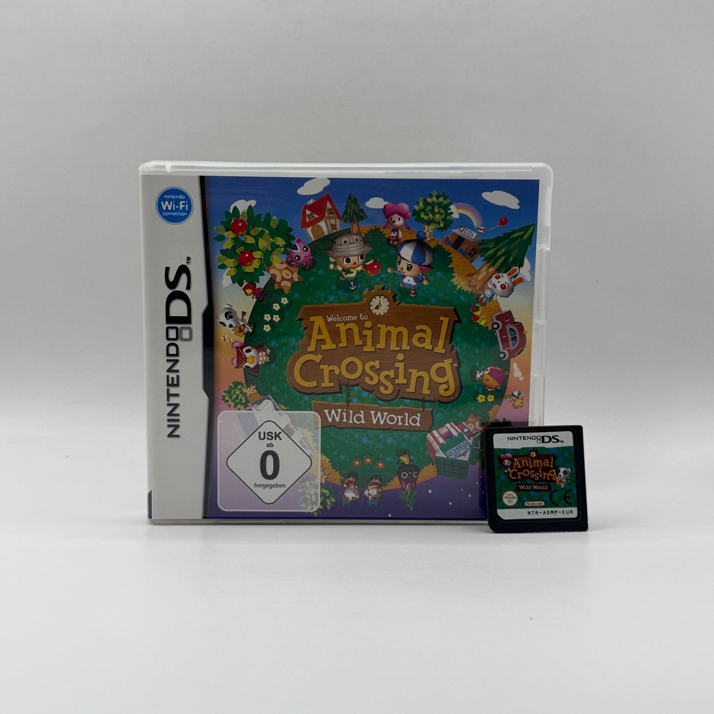 Verpackung des Nintendo DS-Spiels Animal Crossing: Wild World, ein Lebenssimulationsspiel, in dem Spieler in einem Dorf mit tierischen