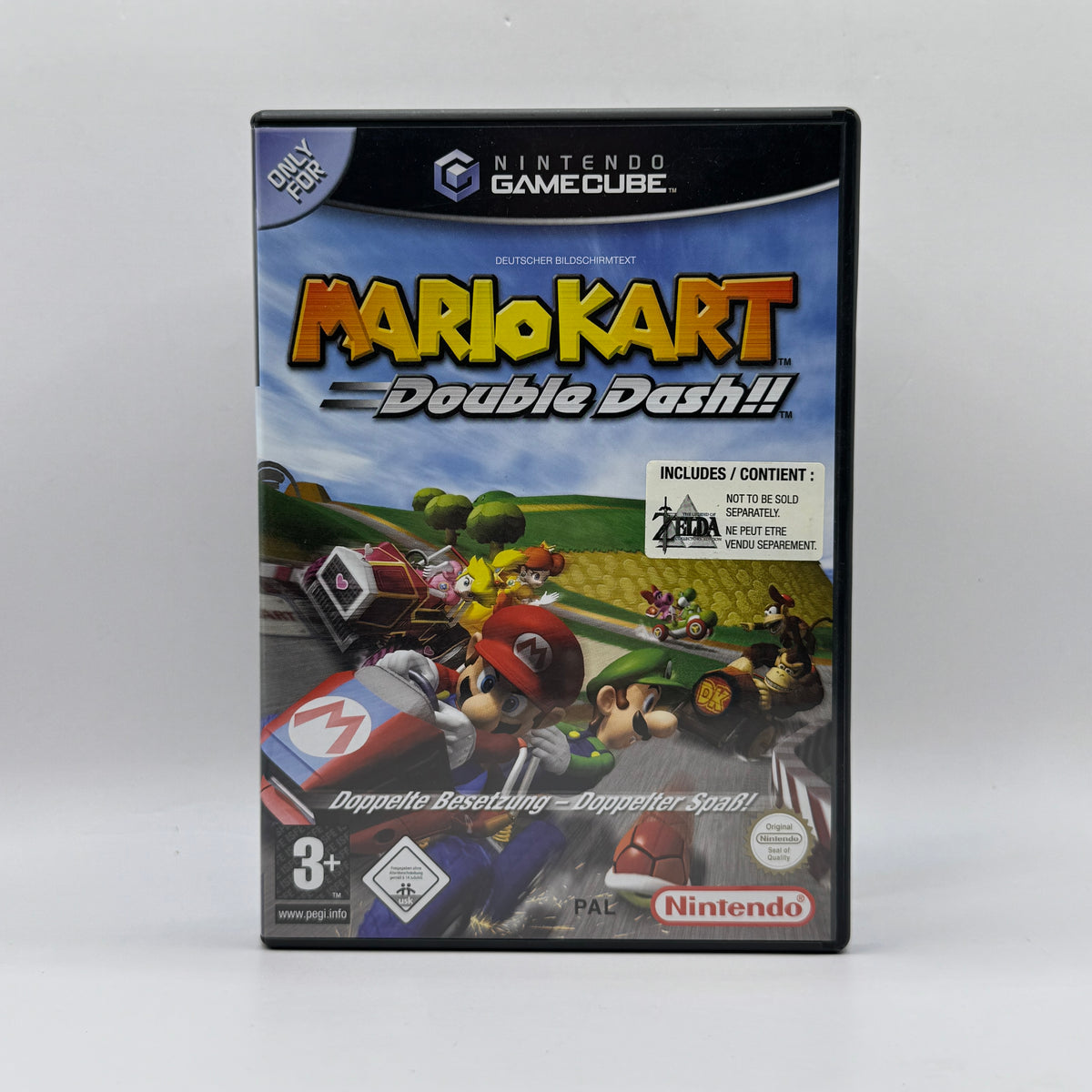 Verpackung des Nintendo GameCube-Spiels Mario Kart: Double Dash!! inklusive The Legend of Zelda: Collector’s Edition, mit actionreichen Kart-Rennen sowie einer Sammlung klassischer Zelda-Abenteuer.