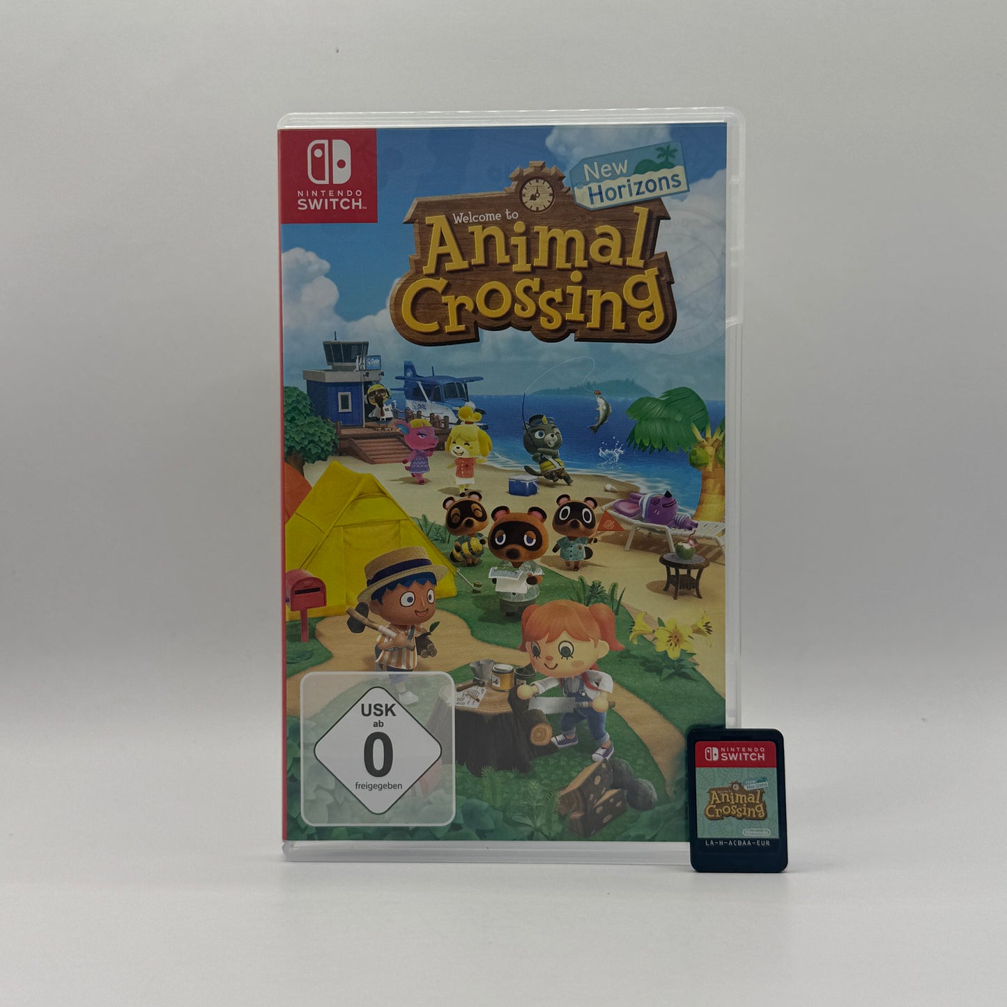 Verpackung des Switch-Spiels Animal Crossing: New Horizons, ein Lebenssimulationsspiel, in dem Spieler eine eigene Insel gestalten, bauen, sammeln und mit tierischen Bewohnern interagieren.