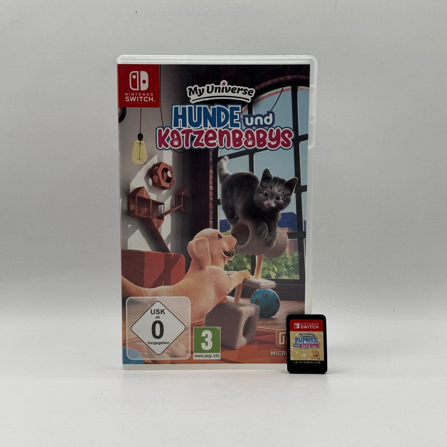 Verpackung des Nintendo Switch-Spiels Hunde und Katzenbabys, eine Tierpflege-Simulation, in der Spieler süße Welpen und Kätzchen versorgen, mit ihnen spielen und sich um ihr Wohl kümmern.