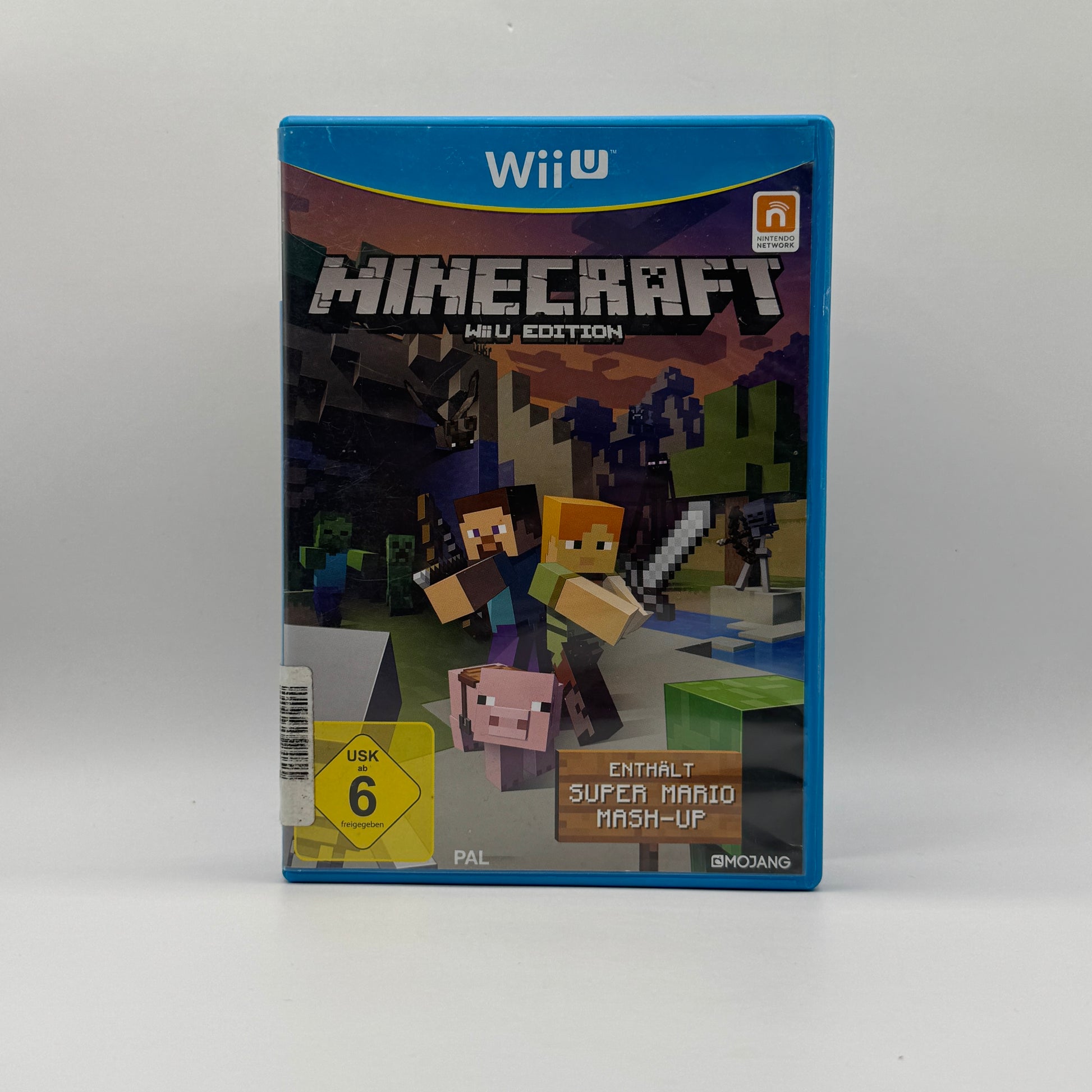 Verpackung des Wii U-Spiels Minecraft, ein Sandbox-Spiel, in dem Spieler Blöcke abbauen, bauen, Ressourcen sammeln und kreative oder Überlebensmodi erleben.