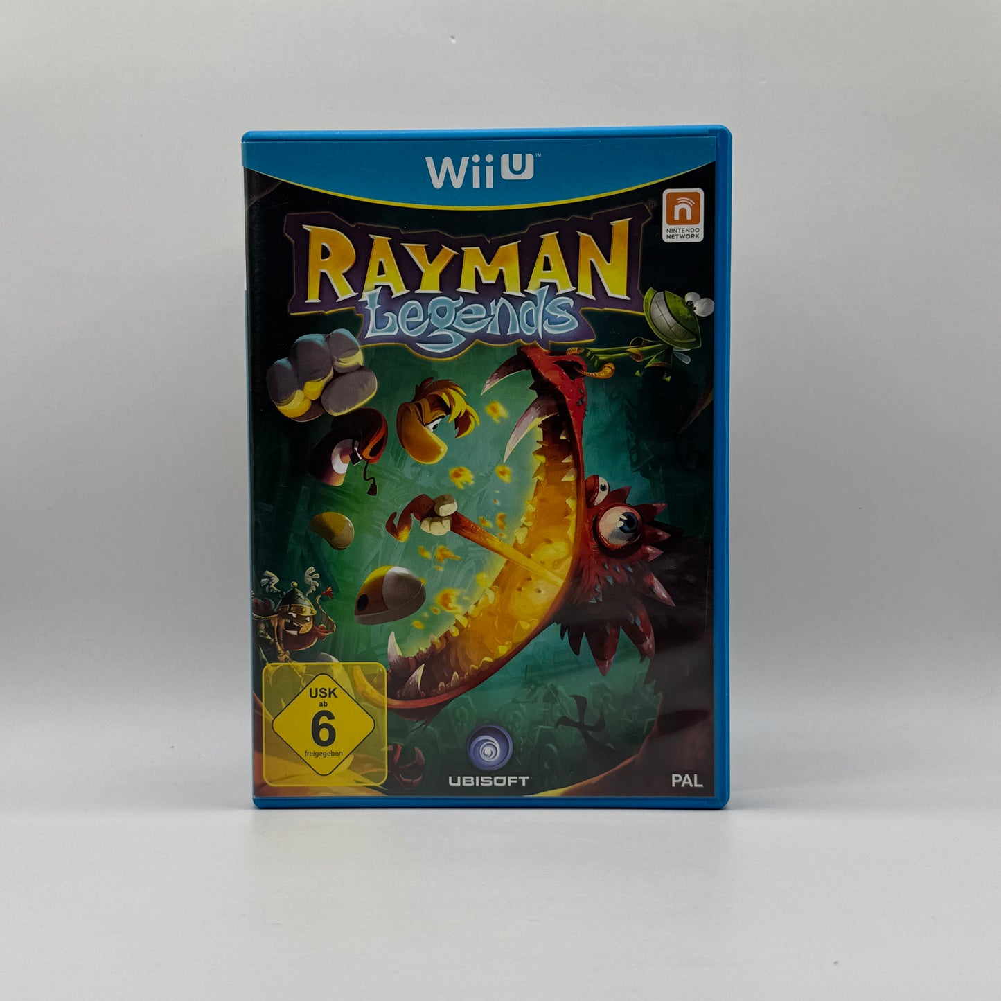 Verpackung des Wii U-Spiels Rayman Legends, ein farbenfrohes 2D-Platformer-Spiel, in dem Spieler Rayman und Freunde durch kreative Level steuern, Gegner besiegen und Rätsel lösen.