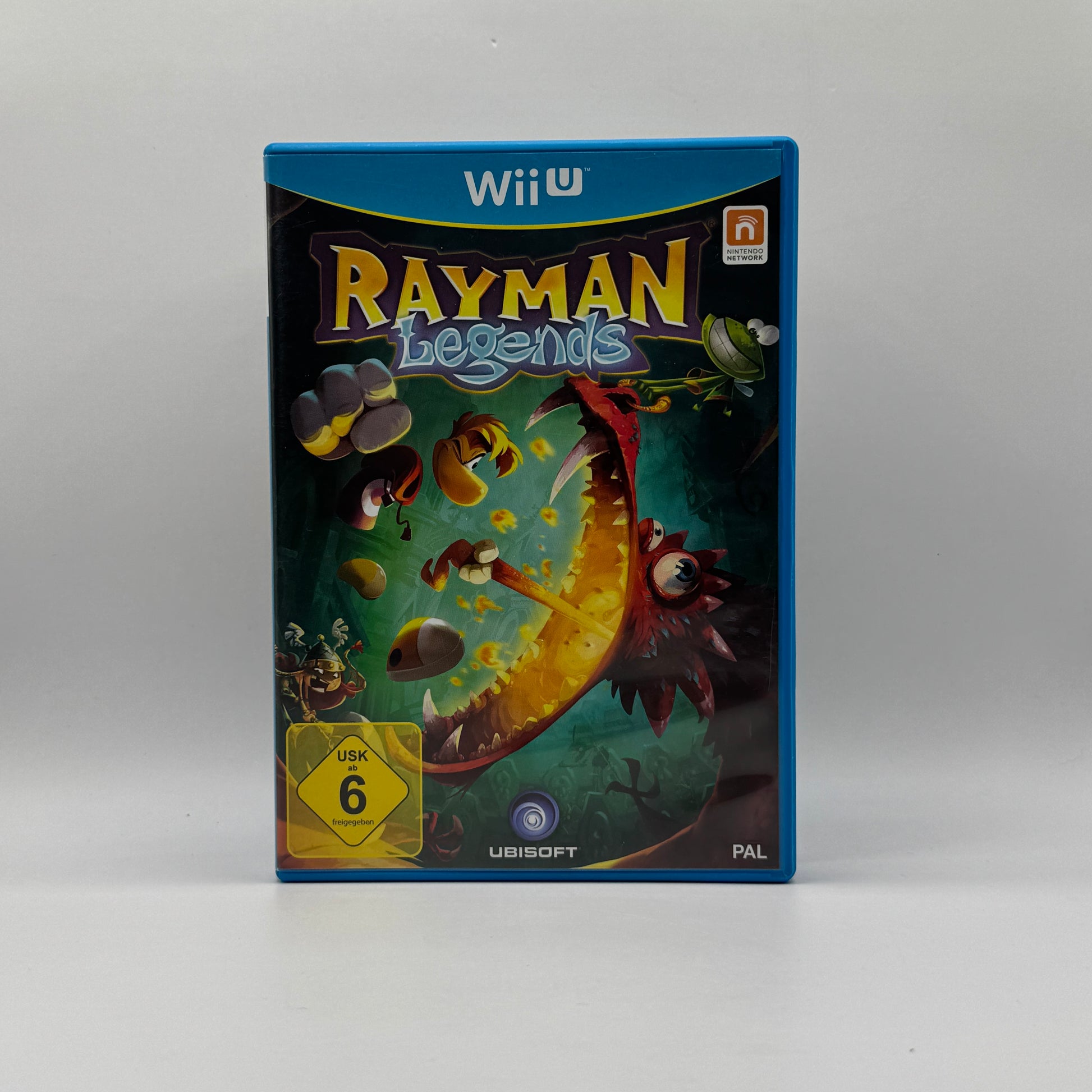 Verpackung des Wii U-Spiels Rayman Legends, ein farbenfrohes 2D-Platformer-Spiel, in dem Spieler Rayman und Freunde durch kreative Level steuern, Gegner besiegen und Rätsel lösen.