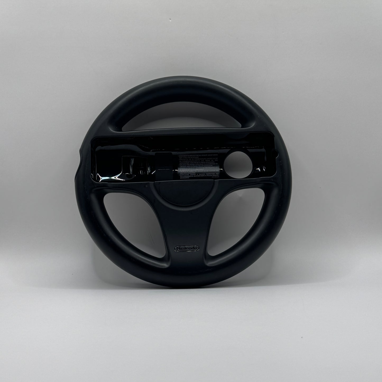 Lenkrad-Aufsatz für Wii U Joy-Con-Controller, zur Nutzung bei Rennspielen für realistischeres Fahrgefühl.