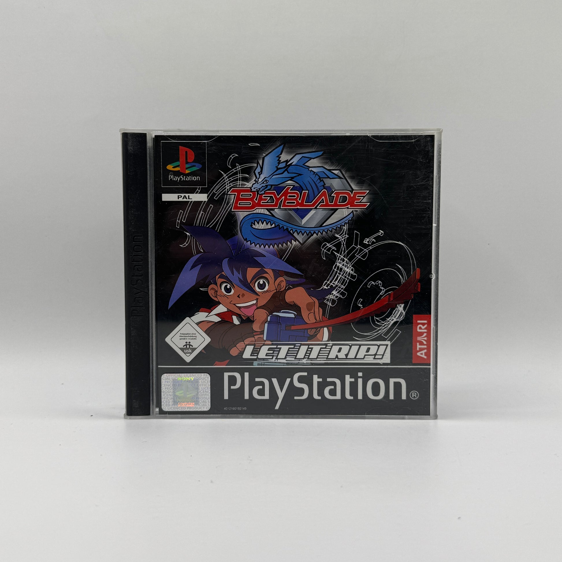 Verpackung des PS1-Spiels Beyblade, ein Action- und Kampfspiel basierend auf der gleichnamigen Anime-Serie, in dem Spieler mit Beyblades gegeneinander antreten und Turniere bestreiten.