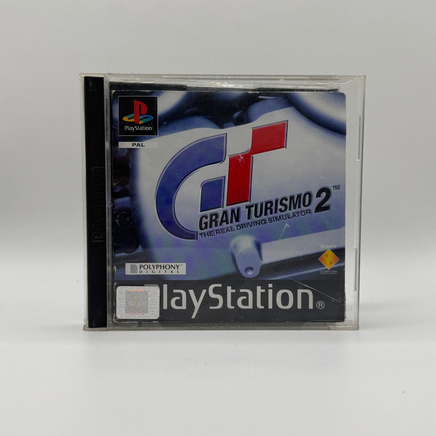 Verpackung des PS1-Spiels Gran Turismo 2, ein realistisches Rennspiel mit umfangreichem Fahrzeugangebot, Karrieremodus und verschiedenen Rennstrecken.