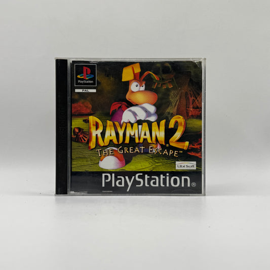 Verpackung des PS1-Spiels Rayman 2: The Great Escape, ein 3D-Platformer, in dem Spieler Rayman durch abwechslungsreiche Welten steuern, Gegner besiegen und Rätsel lösen.