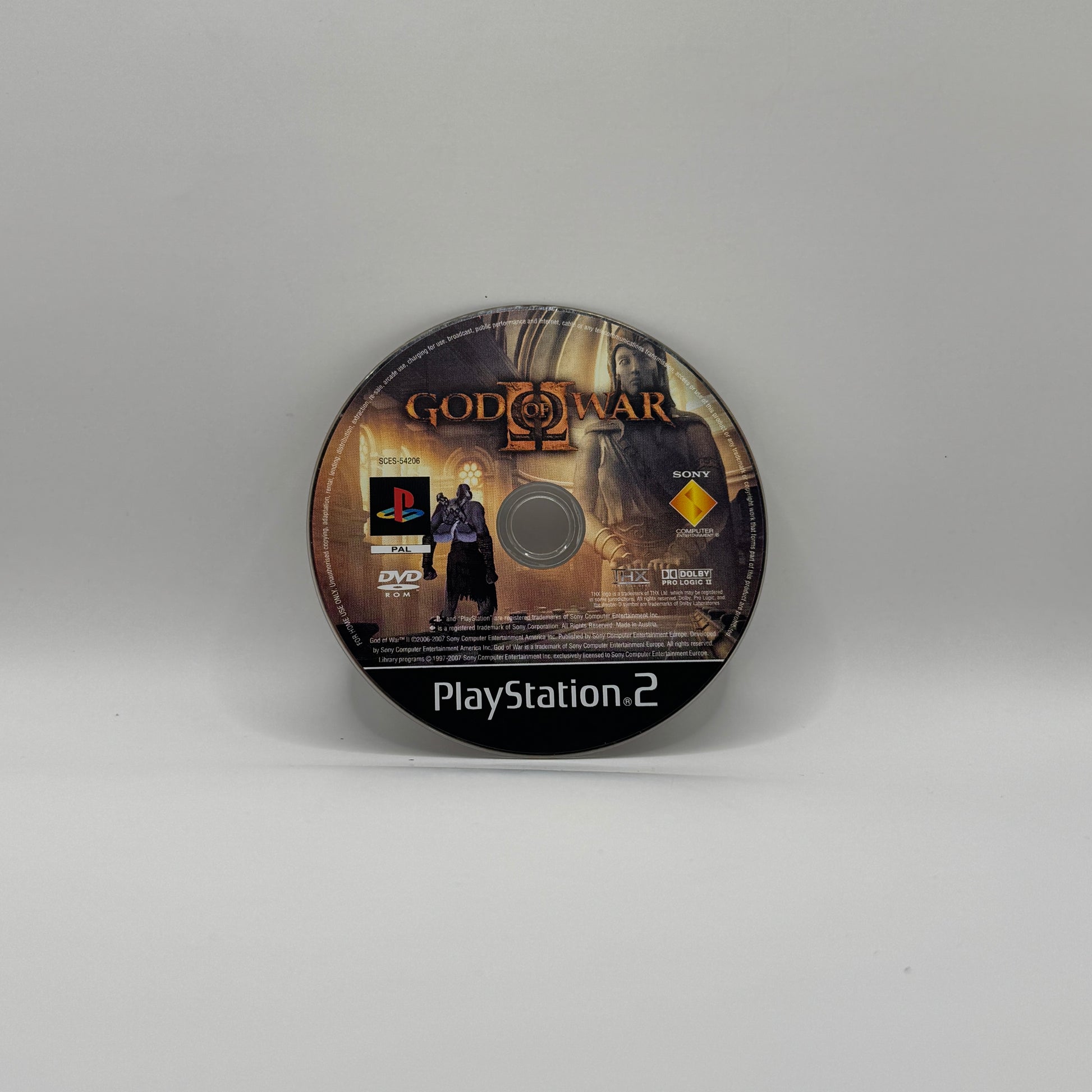 Verpackung des PS2-Spiels God of War II, ein Action-Adventure, in dem Spieler als Kratos gegen Götter und mythische Kreaturen kämpfen und eine epische Geschichte der griechischen Mythologie erleben.