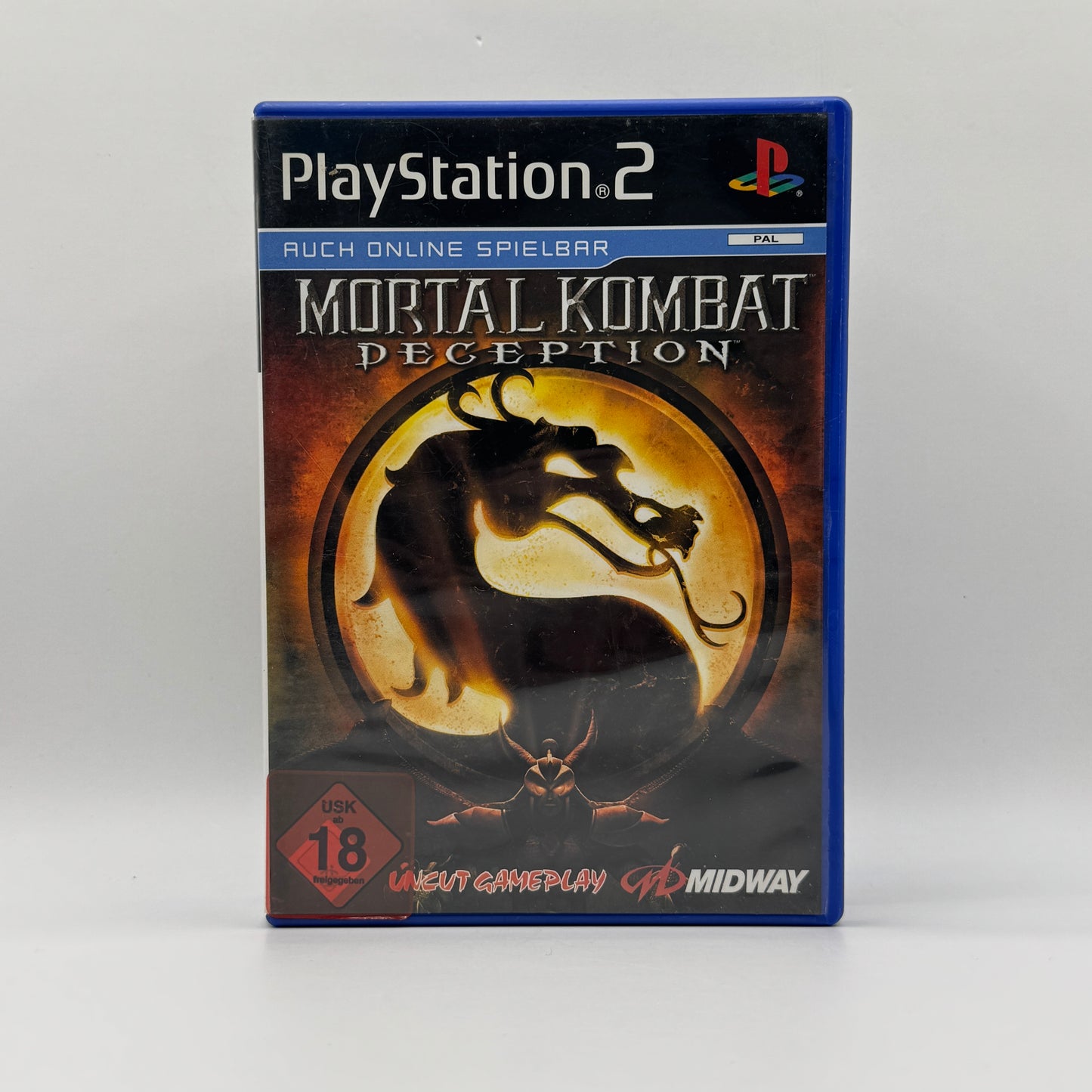 Verpackung des PS2-Spiels Mortal Kombat: Deception, ein Kampfspiel mit düsterer Atmosphäre, zahlreichen Charakteren, brutalen Fatalities und zusätzlichen Spielmodi wie Konquest.