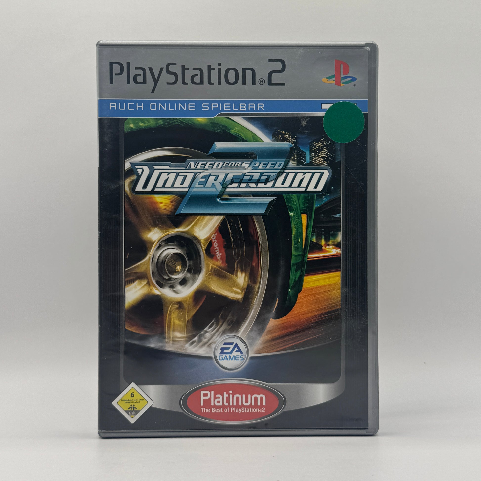 Verpackung des PS2-Spiels Need for Speed Underground 2, ein Straßenrennspiel mit offener Stadt, umfangreichem Tuning und verschiedenen Rennmodi.