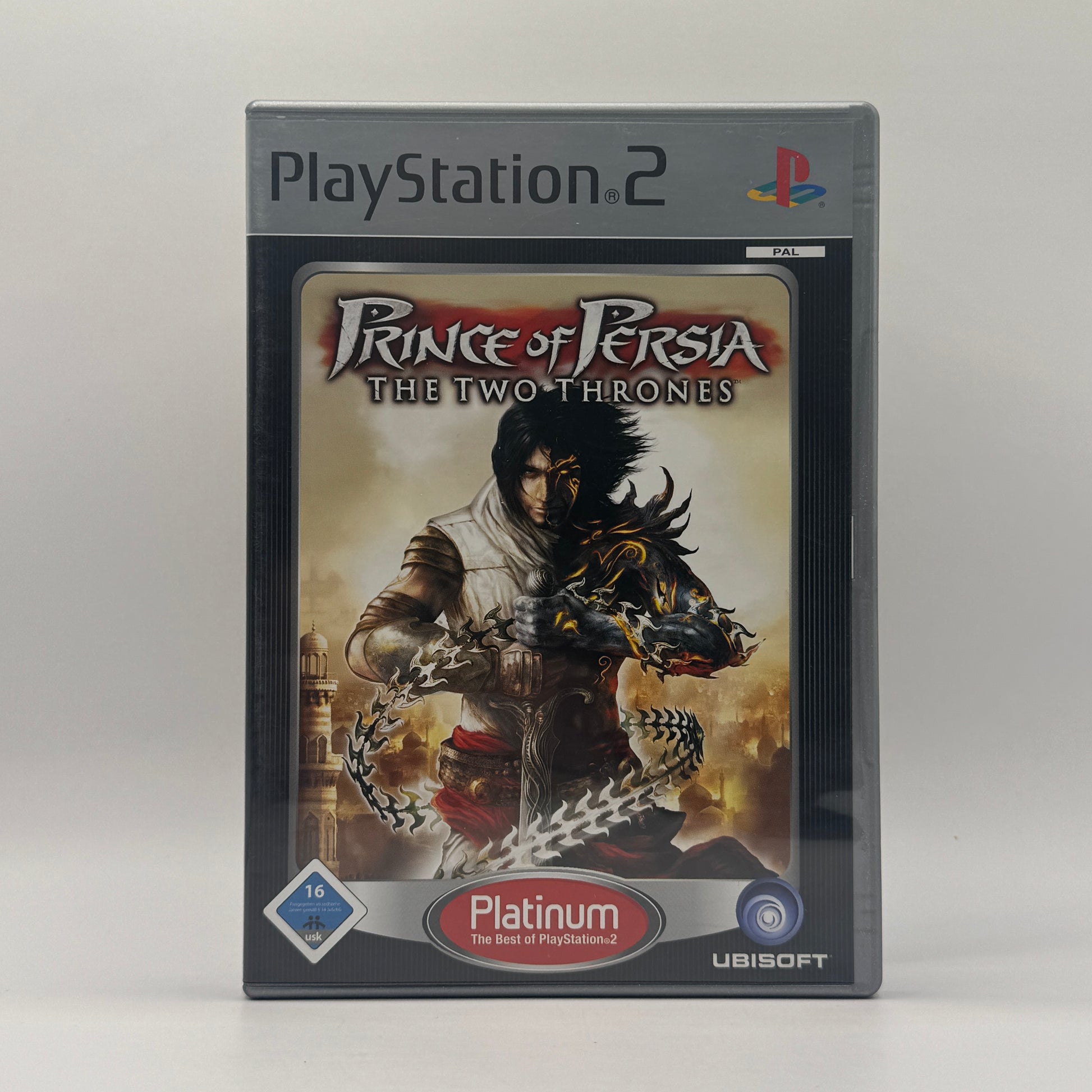 Verpackung des PS2-Spiels Prince of Persia: The Two Thrones, ein Action-Adventure, in dem der Prinz akrobatische Kämpfe bestreitet, Zeitmanipulation nutzt und Babylon von Feinden befreit.