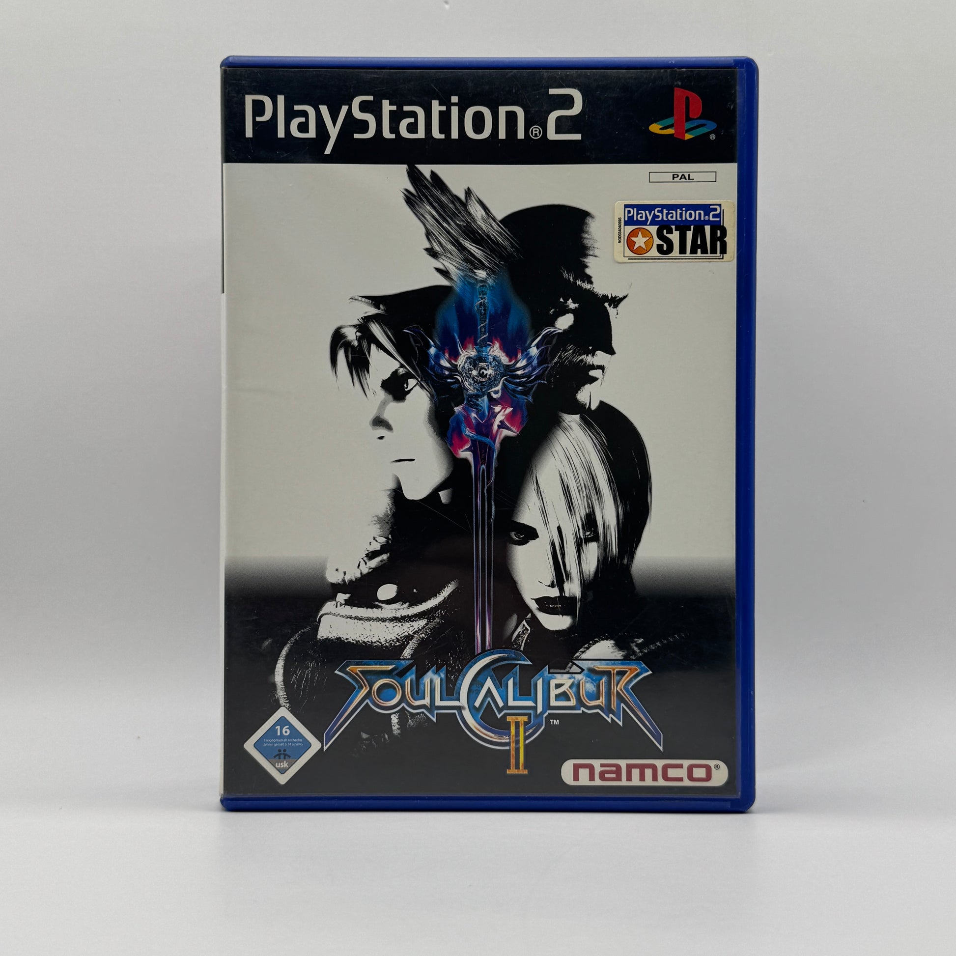 Verpackung des PS2-Spiels Soul Calibur II, ein 3D-Kampfspiel mit Waffen, vielfältigen Charakteren und schnellen, taktischen Duellen in unterschiedlichen Arenen.