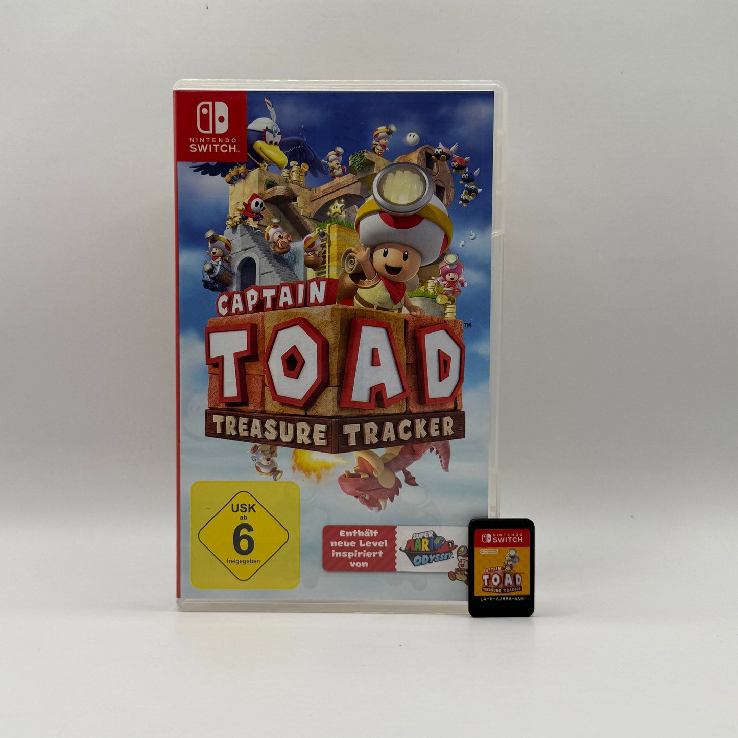 Verpackung des Nintendo Switch-Spiels Captain Toad: Treasure Tracker, ein Puzzle- und Abenteuerspiel, in dem Spieler Captain Toad durch 3D-Level führen, Rätsel lösen und versteckte Schätze finden.